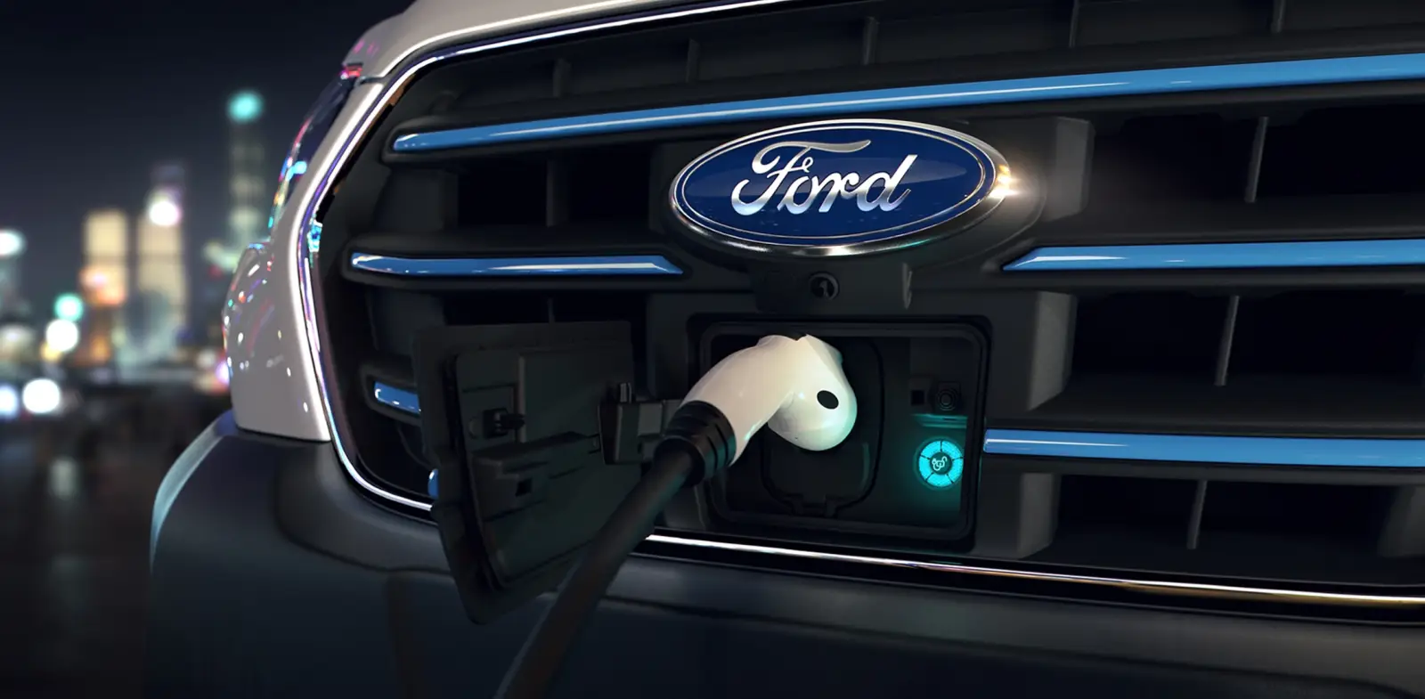 Charging plug connected to the front charge port of a Ford E-Transit at night