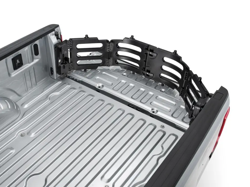 Fold-out bed extender installed at the open tailgate of a Ford pickup bed