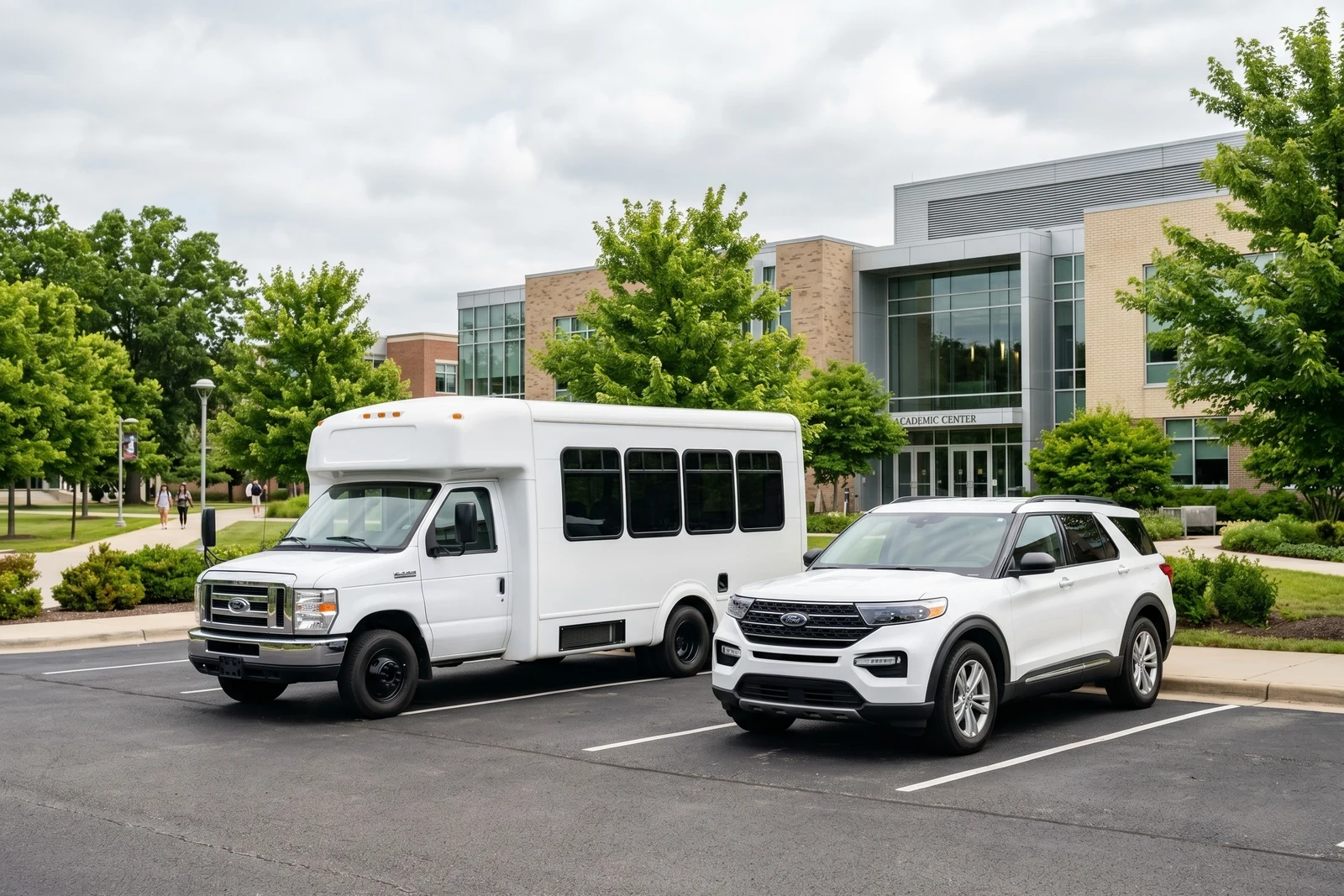 Ford E-Series shuttle bus and Explorer SUV at university campus for education fleet use