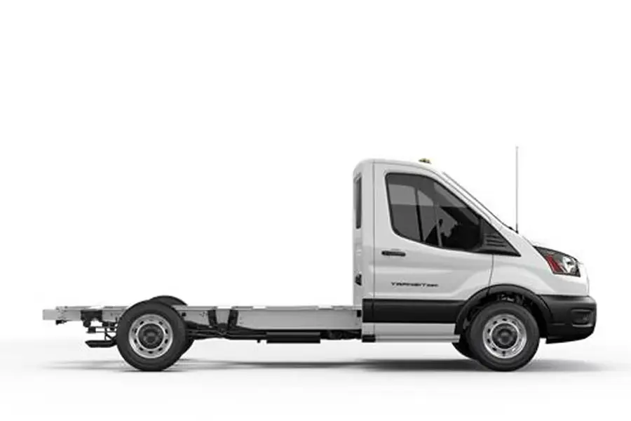 White Ford Transit chassis cab in profile with bare frame rails and no body fitted